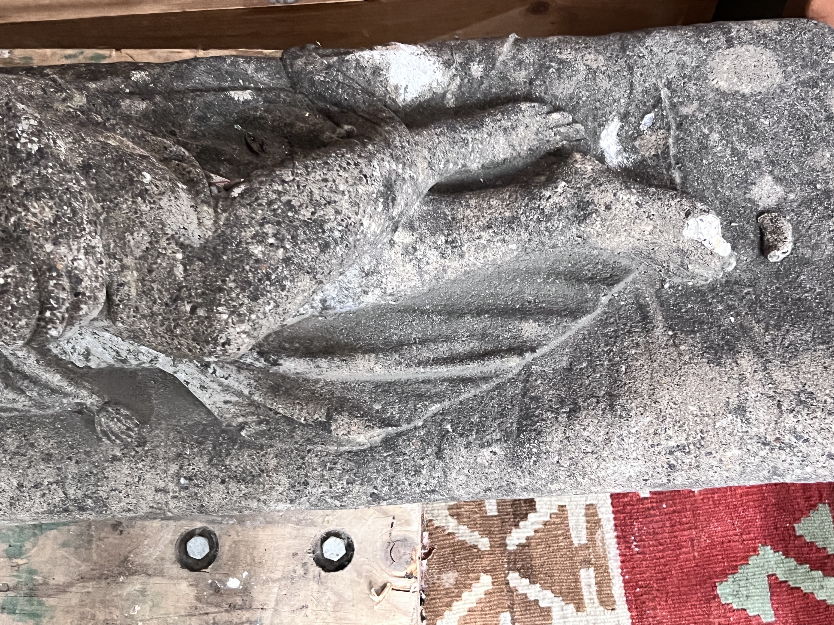 A reconstituted stone reclining female garden ornament, length 90cm, height 50cm